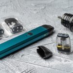 Vape pod system and replacement cartridges filled with e-juice or liquid with salt nicotine, new vape pen device, close up